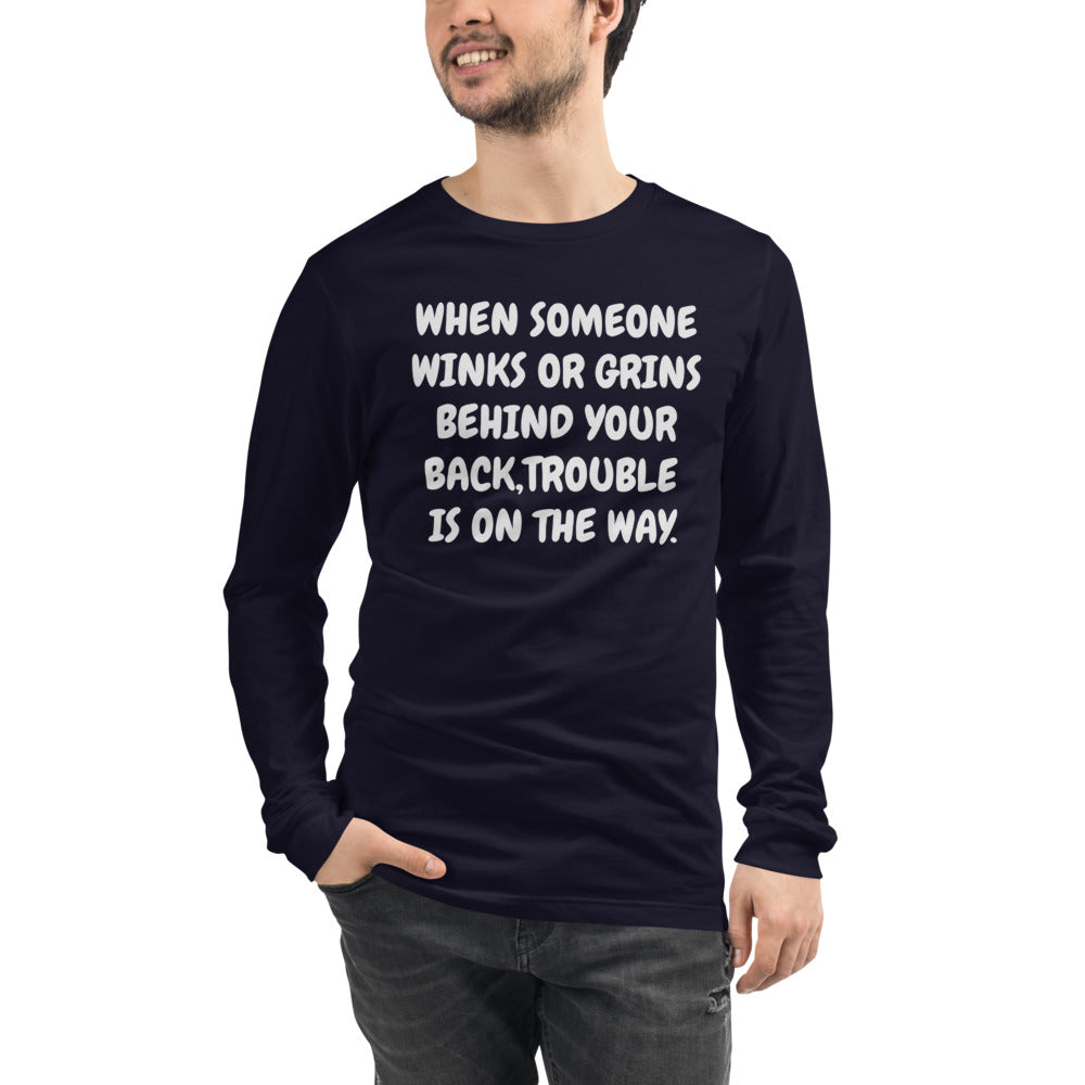 Unisex Navy Tee with, When someone winks or grins behind your back, trouble is on the way in White letters