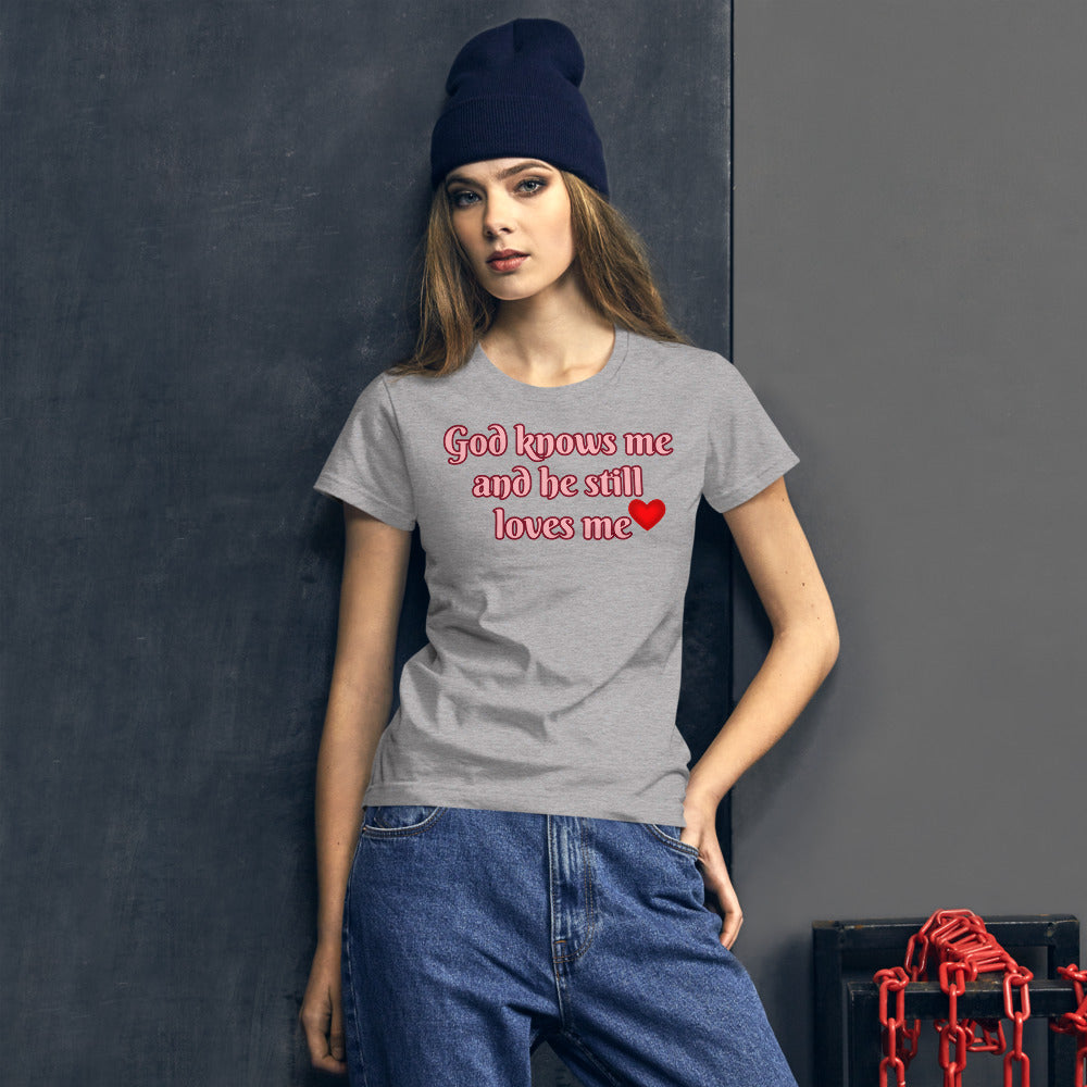 Heather Grey Women's t-shirt with God knows me and he still loves me in Light Pink letters outlined in burgundy with a red heart