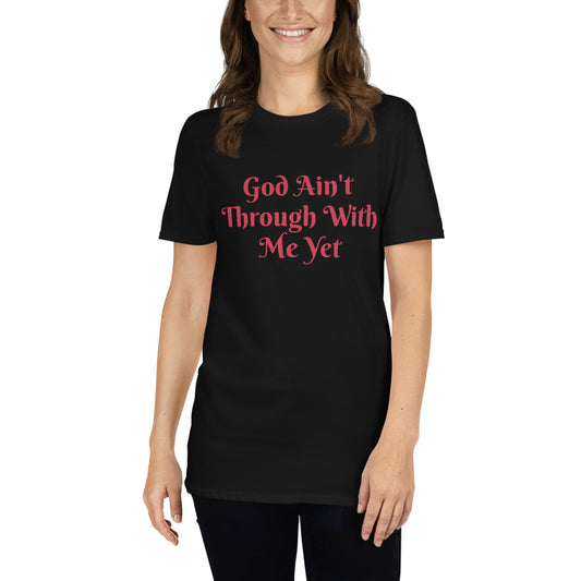 Unisex soft-style black t-shirt with GOD AIN'T THROUGH WITH ME YET in Red letters