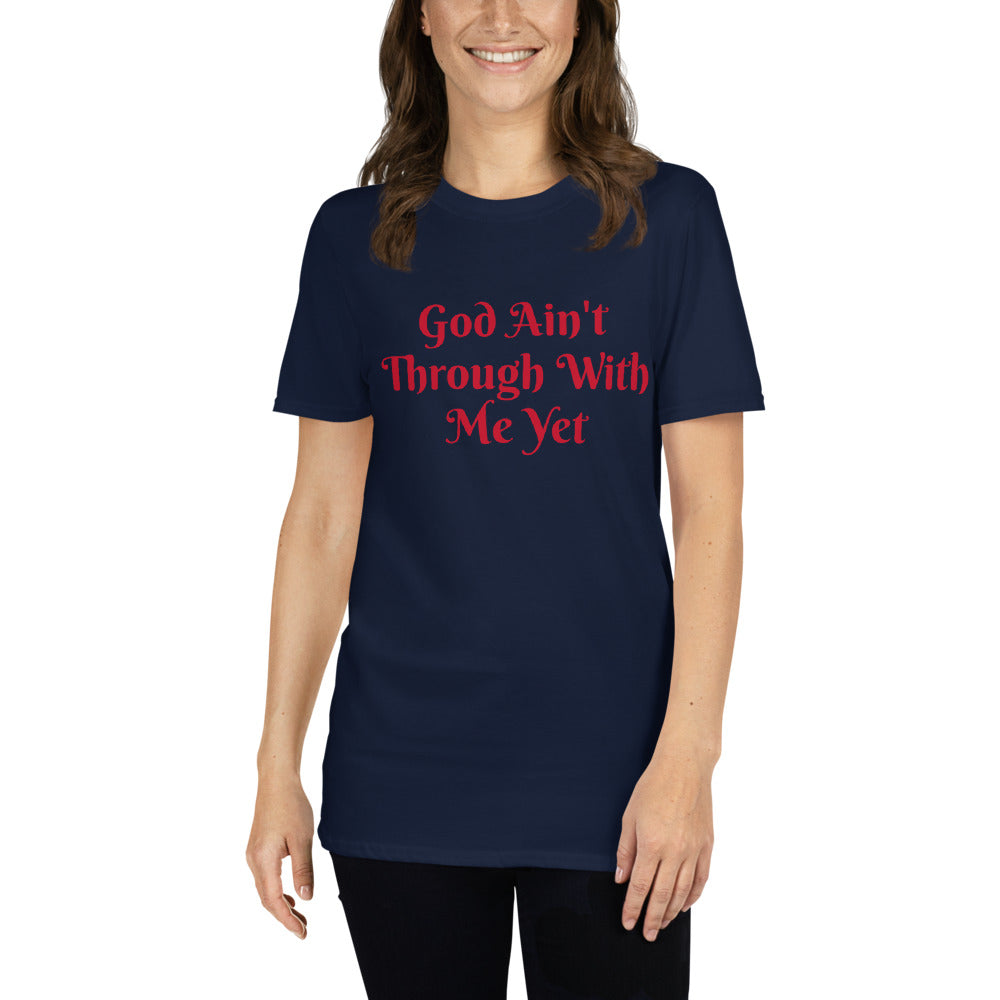 Unisex soft-style Navy t-shirt with GOD AIN'T THROUGH WITH ME YET in Red letters