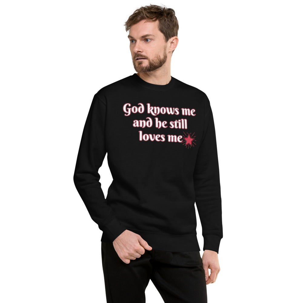 Unisex Black Fleece Pullover with God knows Me and he still loves me in white letters and outlined in red and a red star