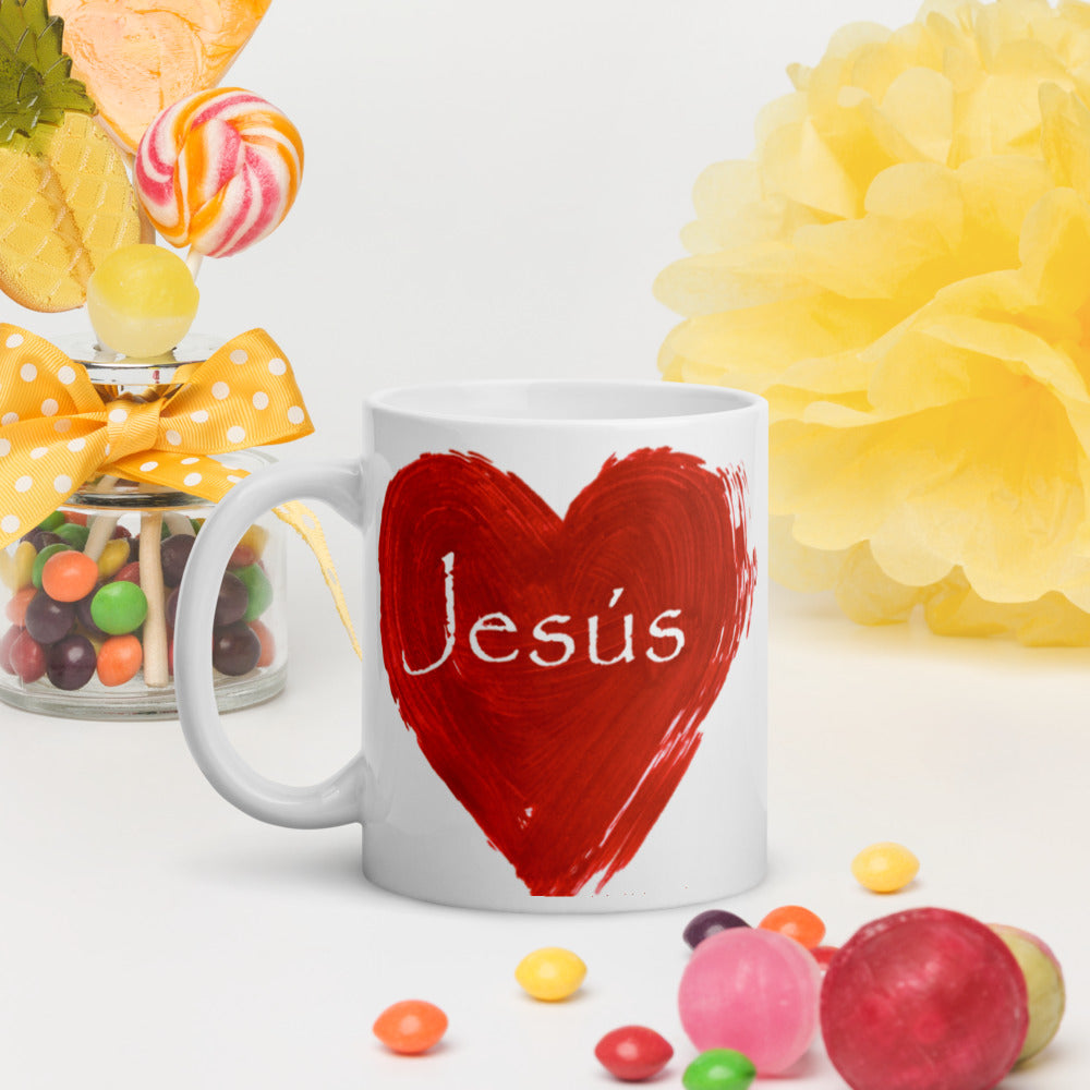 White 11.0z mug with a Red heart with Jesus' name written in white on the outside of the mug heart.